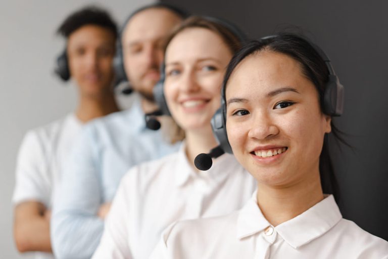 Selective focus photo of a woman wearing a black headset